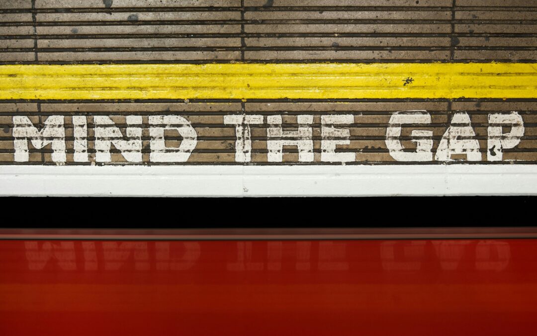 image of the train platform in England with the words "mind the gap"