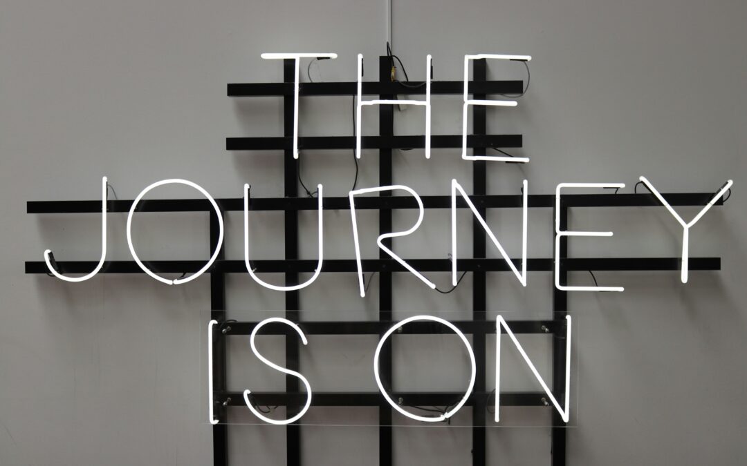neon sign that says the journey is on. Hopefully, it's you goal journey design.